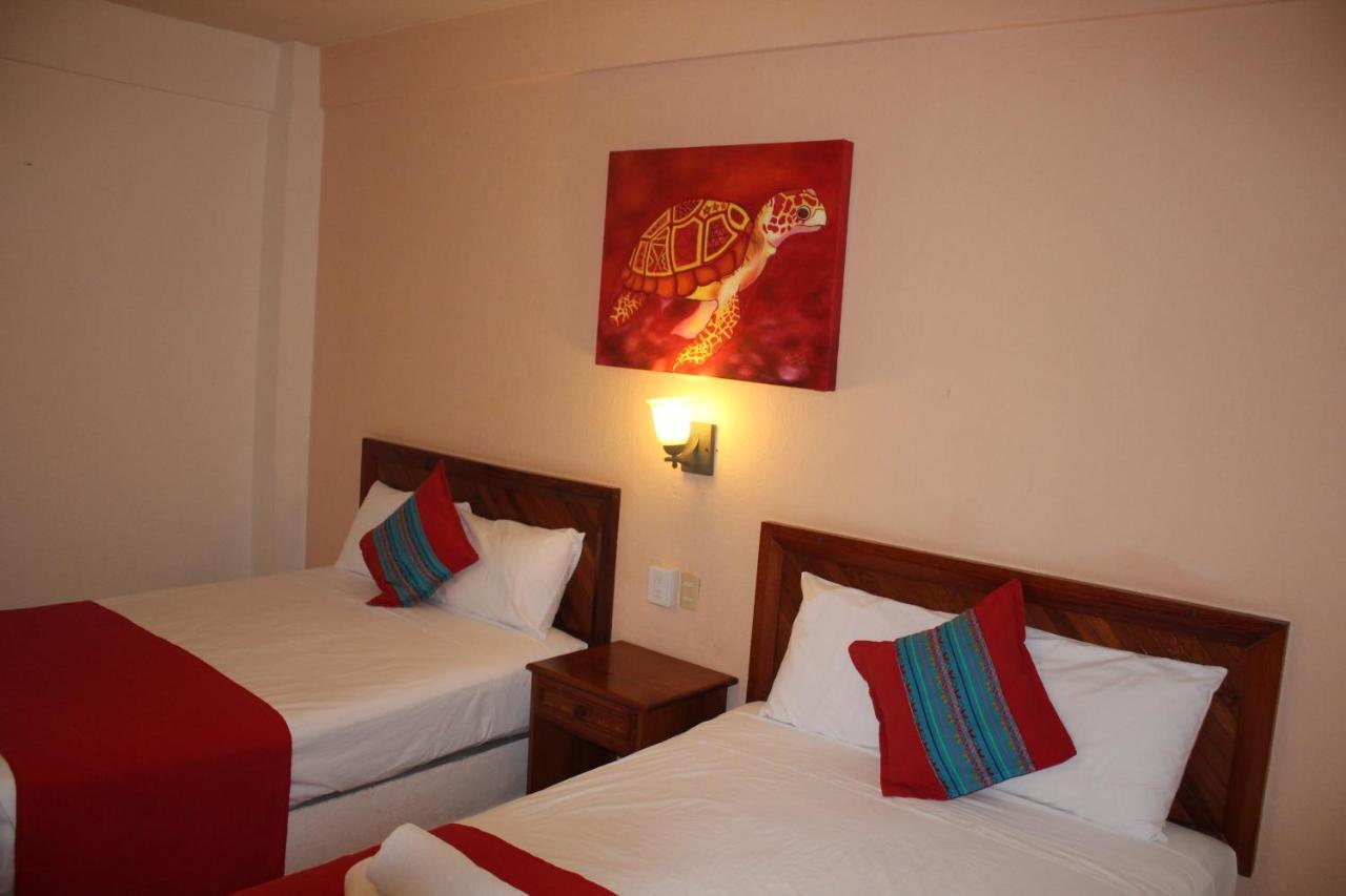 Hotel Arenas Del Pacifico Санта-Крус-Хуатулко Экстерьер фото