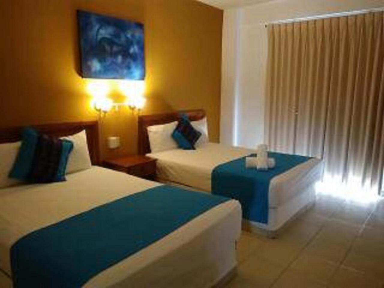 Hotel Arenas Del Pacifico Санта-Крус-Хуатулко Экстерьер фото